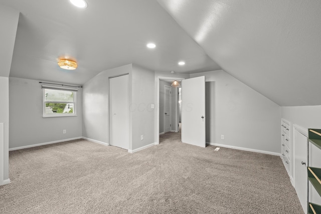 1296 Bryson Rd, Columbus, OH 43224 - bonus room featuring vaulted ceiling, carpet, baseboards, and recessed lighting