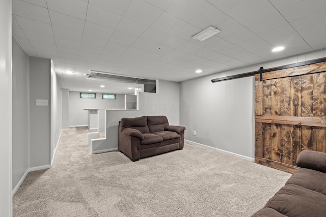1296 Bryson Rd, Columbus, OH 43224 - living area featuring carpet flooring, a barn door, baseboards, and recessed lighting