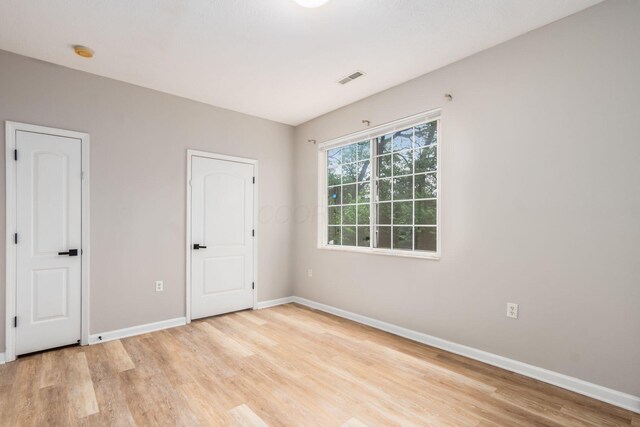 1989 Berrancher Dr, Columbus, OH 43228 - unfurnished bedroom with baseboards and light wood-style floors