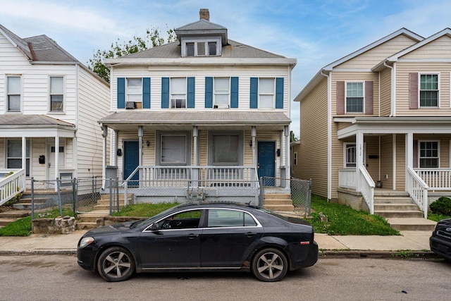 1808 S 6th St, Columbus, OH 43207 - view of front of home featuring covered porch and a chimney