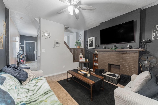 1808 S 6th St, Columbus, OH 43207 - carpeted living room featuring ceiling fan, a brick fireplace, a textured ceiling, and baseboards