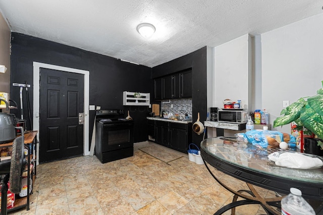 1808 S 6th St, Columbus, OH 43207 - kitchen with black range with electric stovetop, dark cabinets, light countertops, backsplash, and a textured ceiling