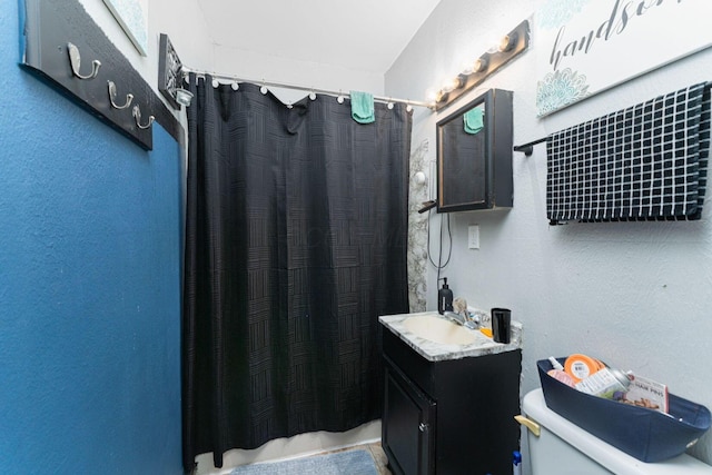 1808 S 6th St, Columbus, OH 43207 - bathroom featuring toilet, vanity, and a shower with curtain