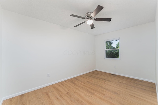 1747 E 25th Ave, Columbus, OH 43219 - spare room with baseboards, light wood-style flooring, and ceiling fan