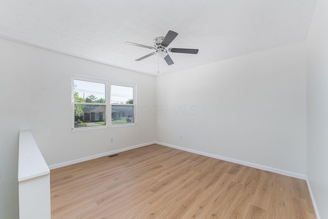 1747 E 25th Ave, Columbus, OH 43219 - spare room with light wood-style flooring, baseboards, and a ceiling fan