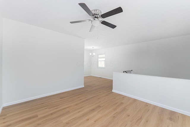 1747 E 25th Ave, Columbus, OH 43219 - unfurnished room with baseboards, light wood-style floors, and ceiling fan