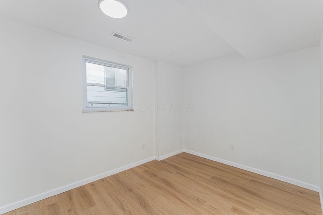 1747 E 25th Ave, Columbus, OH 43219 - spare room featuring light wood finished floors and baseboards