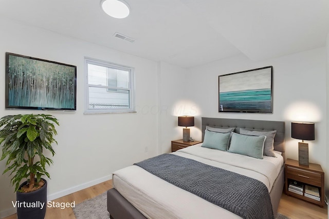 1747 E 25th Ave, Columbus, OH 43219 - bedroom featuring wood finished floors and baseboards