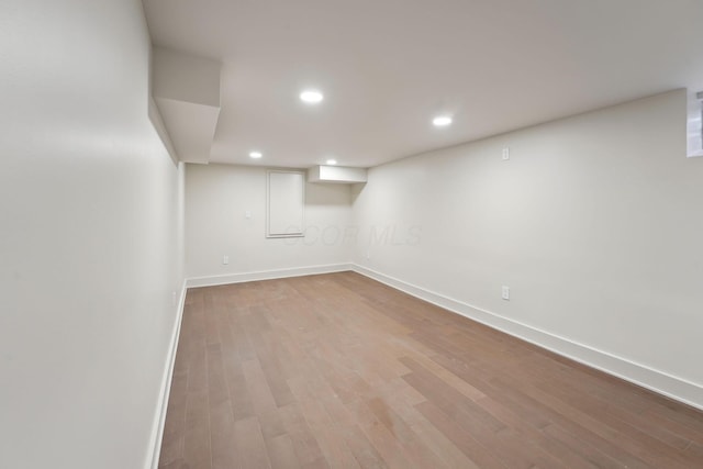 1884 W Lane Ave, Columbus, OH 43221 - finished basement with baseboards, wood finished floors, and recessed lighting