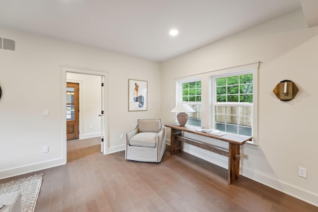 1884 W Lane Ave, Columbus, OH 43221 - sitting room with wood finished floors, baseboards, and recessed lighting