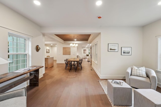 1884 W Lane Ave, Columbus, OH 43221 - living room with a raised ceiling, wood-type flooring, baseboards, recessed lighting, and a chandelier
