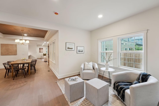 1884 W Lane Ave, Columbus, OH 43221 - living area featuring a chandelier, baseboards, light wood-type flooring, recessed lighting, and a raised ceiling