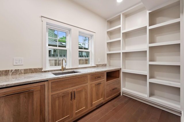 1884 W Lane Ave, Columbus, OH 43221 - kitchen featuring a sink, light stone counters, brown cabinetry, dark wood finished floors, and open shelves