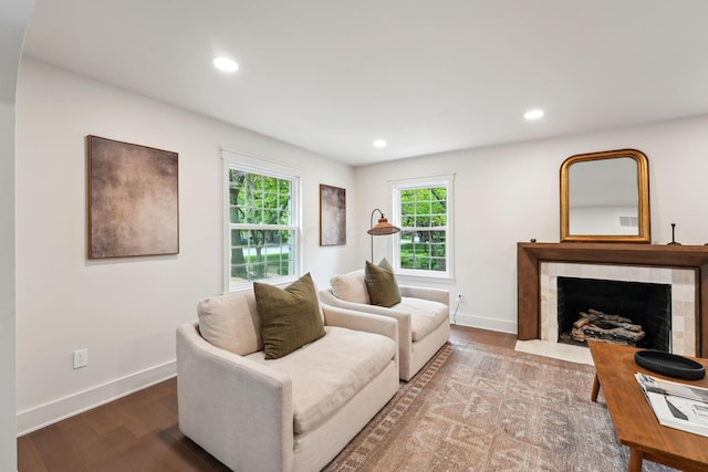 1884 W Lane Ave, Columbus, OH 43221 - living area with baseboards, wood finished floors, a fireplace, and recessed lighting