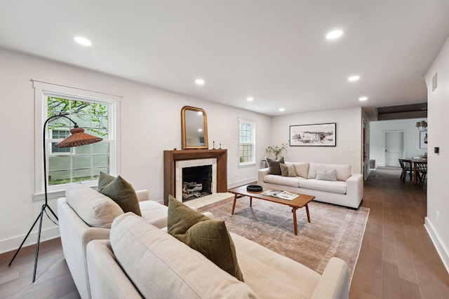 1884 W Lane Ave, Columbus, OH 43221 - living room with healthy amount of natural light, recessed lighting, wood finished floors, a premium fireplace, and baseboards