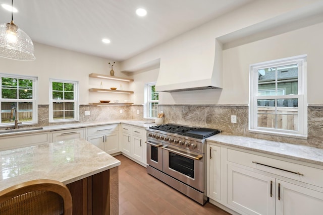 1884 W Lane Ave, Columbus, OH 43221 - kitchen featuring range with two ovens, a sink, light wood-style floors, healthy amount of natural light, and recessed lighting