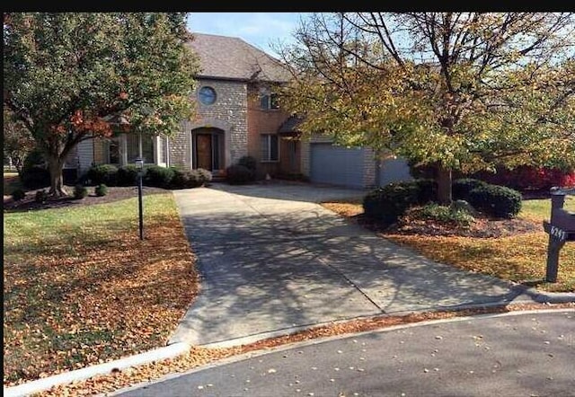 6247 Inverurie Dr W, Dublin, OH 43017 - view of front of property with driveway and an attached garage
