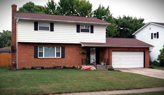 5740 Satinwood Dr, Columbus, OH 43229 - colonial inspired home with a garage, brick siding, a chimney, and driveway