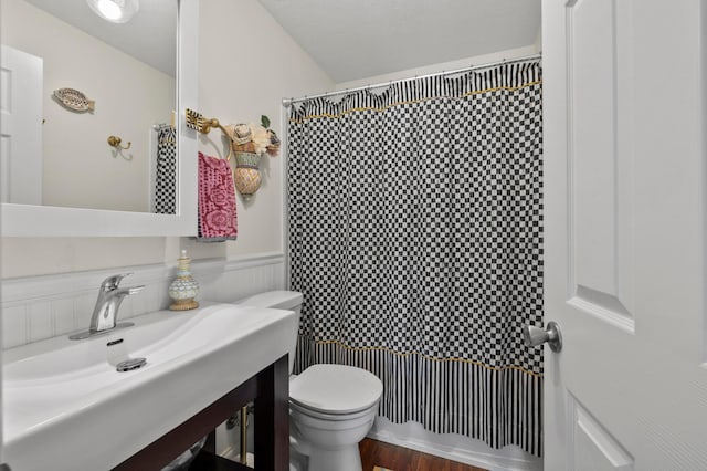 4088 Sweet Shadow Ave, Columbus, OH 43230 - bathroom featuring toilet, curtained shower, vanity, wood finished floors, and wainscoting