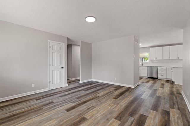 4778 Hafey Ave, Columbus, OH 43228 - unfurnished living room with dark wood-style flooring and a textured ceiling