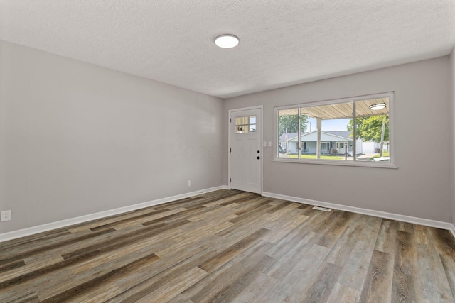 4778 Hafey Ave, Columbus, OH 43228 - foyer entrance with wood finished floors and a textured ceiling