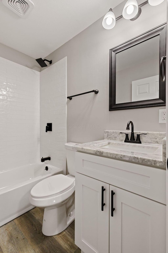 4778 Hafey Ave, Columbus, OH 43228 - bathroom featuring wood finished floors, vanity, and tub / shower combination