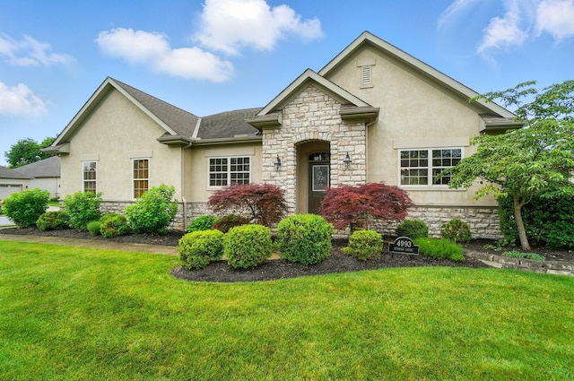 4993 Denbigh Ct, Columbus, OH 43220 - french country inspired facade with stone siding, stucco siding, and a front yard