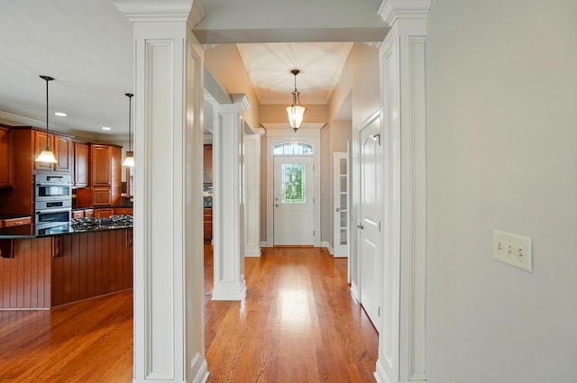 4993 Denbigh Ct, Columbus, OH 43220 - corridor with ornate columns, light wood finished floors, and crown molding
