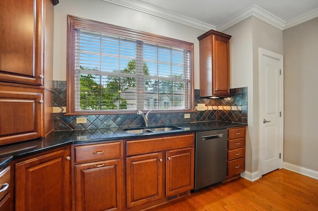 4993 Denbigh Ct, Columbus, OH 43220 - kitchen featuring stainless steel dishwasher, light wood finished floors, plenty of natural light, tasteful backsplash, and crown molding