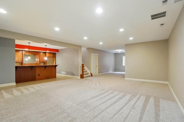 4993 Denbigh Ct, Columbus, OH 43220 - unfurnished living room with recessed lighting, light colored carpet, and stairs
