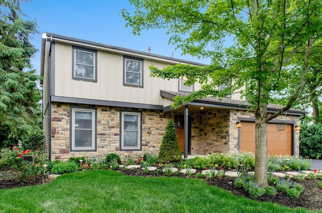 1672 Flat Rock Ct, Columbus, OH 43235 - view of front of home featuring stone siding, board and batten siding, a front yard, and a garage
