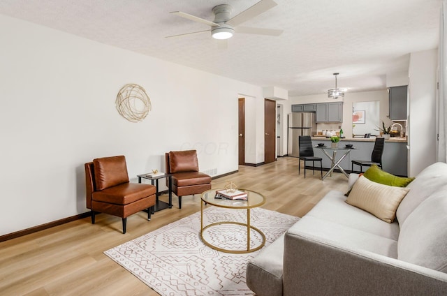 1672 Flat Rock Ct, Columbus, OH 43235 - living area featuring light wood-style flooring, baseboards, and ceiling fan