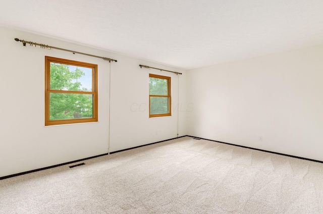1672 Flat Rock Ct, Columbus, OH 43235 - unfurnished room with healthy amount of natural light, carpet, and baseboards