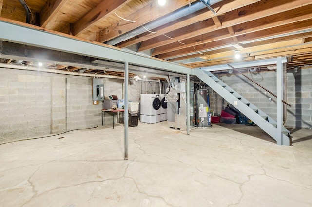 1672 Flat Rock Ct, Columbus, OH 43235 - unfinished below grade area featuring gas water heater, washer and clothes dryer, electric panel, and stairway