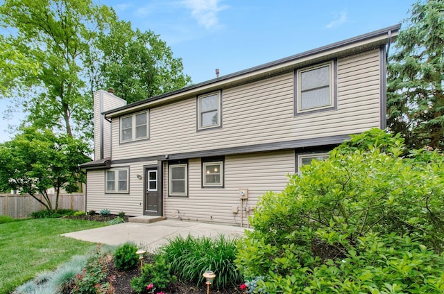 1672 Flat Rock Ct, Columbus, OH 43235 - rear view of house with a chimney and a patio