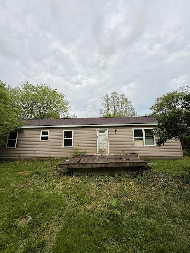 3436 London Lancaster Rd, Groveport, OH 43125 - rear view of house featuring a wooden deck and a yard