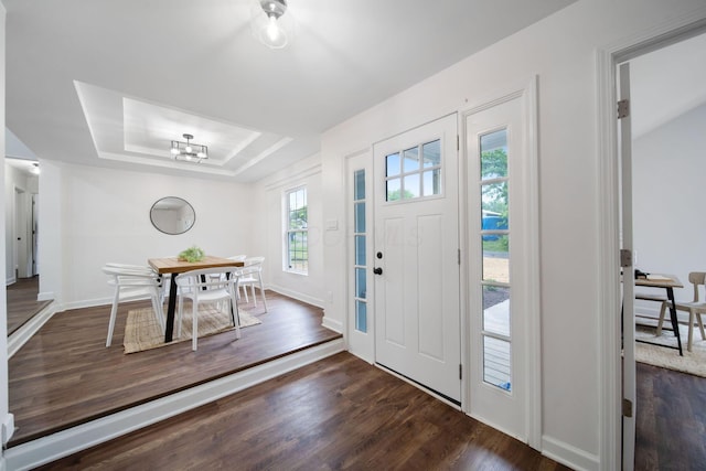 13404 Maple Rd NE, Thornville, OH 43076 - entryway with a raised ceiling, wood finished floors, baseboards, and a chandelier