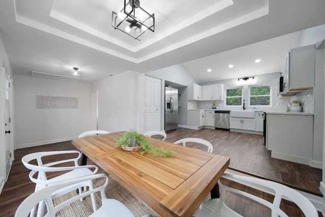 13404 Maple Rd NE, Thornville, OH 43076 - dining room with a raised ceiling, wood finished floors, recessed lighting, a chandelier, and baseboards