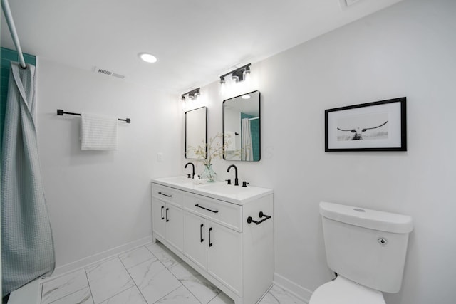 13404 Maple Rd NE, Thornville, OH 43076 - bathroom with marble finish floors, baseboards, double vanity, and recessed lighting