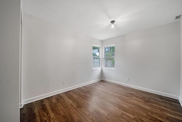 13404 Maple Rd NE, Thornville, OH 43076 - empty room with dark wood-style flooring and baseboards