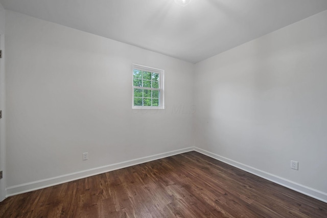 13404 Maple Rd NE, Thornville, OH 43076 - unfurnished room featuring dark wood-style flooring and baseboards