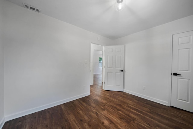 13404 Maple Rd NE, Thornville, OH 43076 - empty room with dark wood finished floors and baseboards