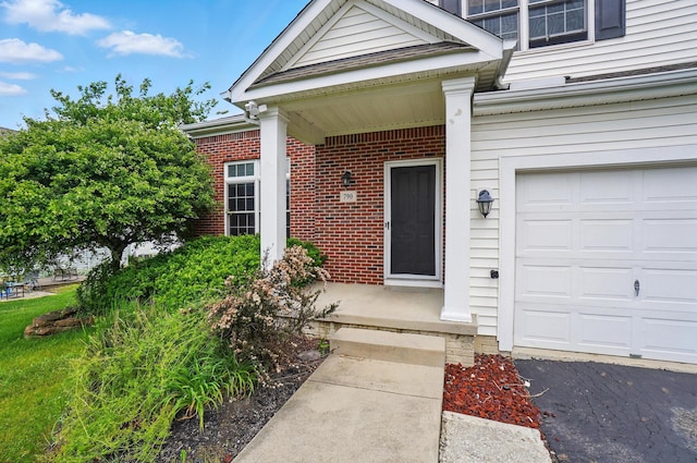 790 Salinger Dr, Lithopolis, OH 43136 - property entrance with a garage and brick siding