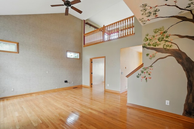 790 Salinger Dr, Lithopolis, OH 43136 - unfurnished living room featuring high vaulted ceiling, hardwood / wood-style flooring, ceiling fan, and baseboards