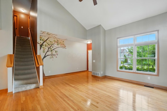 790 Salinger Dr, Lithopolis, OH 43136 - empty room with ceiling fan, baseboards, light wood-type flooring, and high vaulted ceiling