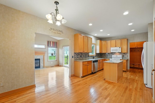 790 Salinger Dr, Lithopolis, OH 43136 - kitchen featuring white appliances, a chandelier, light wood-style flooring, a kitchen island, and open floor plan