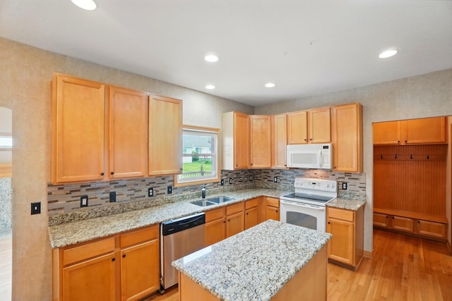 790 Salinger Dr, Lithopolis, OH 43136 - kitchen with white appliances, a sink, light wood-style floors, decorative backsplash, and light stone counters