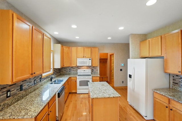 790 Salinger Dr, Lithopolis, OH 43136 - kitchen with white appliances, a sink, a center island, light wood-style floors, and backsplash