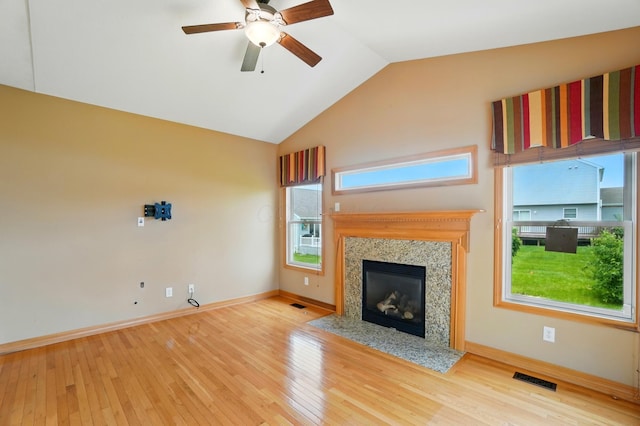 790 Salinger Dr, Lithopolis, OH 43136 - unfurnished living room with a fireplace, wood finished floors, ceiling fan, plenty of natural light, and vaulted ceiling