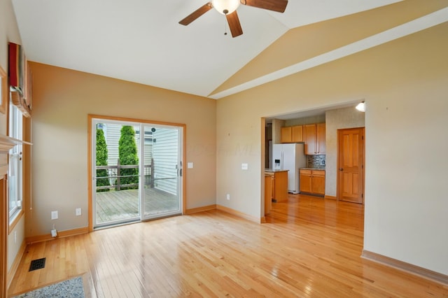790 Salinger Dr, Lithopolis, OH 43136 - unfurnished living room with light wood finished floors, lofted ceiling, ceiling fan, and baseboards